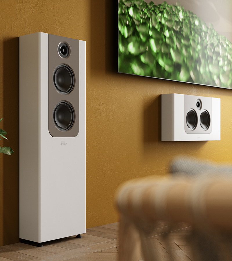 Lyngdorf FR-2 and FR-2 H speakers on a mustard wall